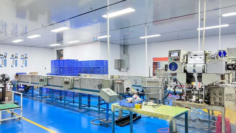 Injection molding workshop with multiple plastic machines in operation